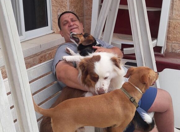 Shmulik taking a break with his dogs.
